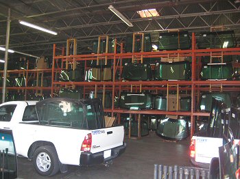 Photo of Jerry and Tammy Jones, owners of Auto Glass by Jerry in Rockwall, Texas, picking up quality OE windshields to install in cars and trucks in Rockwall and around north Texas